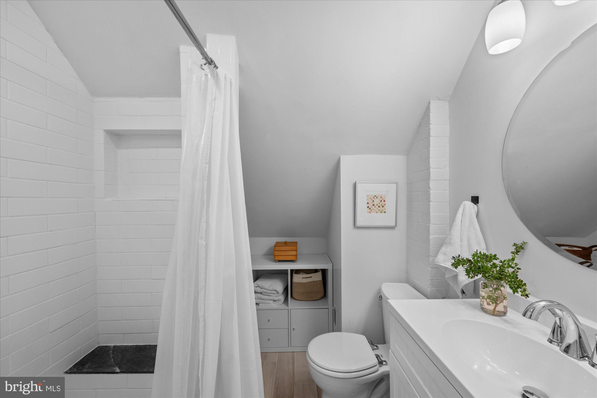3010 Fayette Road Kensington, MD 20895 - Photo 20 of 54 a bathroom with a sink a toilet and shower curtain