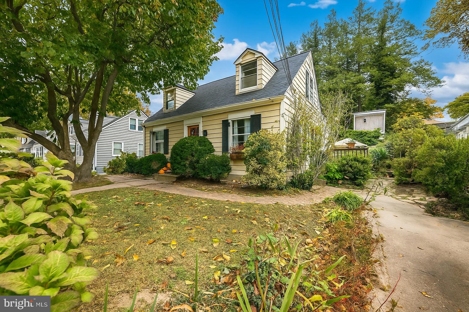 3010 Fayette Road Kensington, MD 20895 - Photo 28 of 54 a view of a white house next to a yard with plants and trees