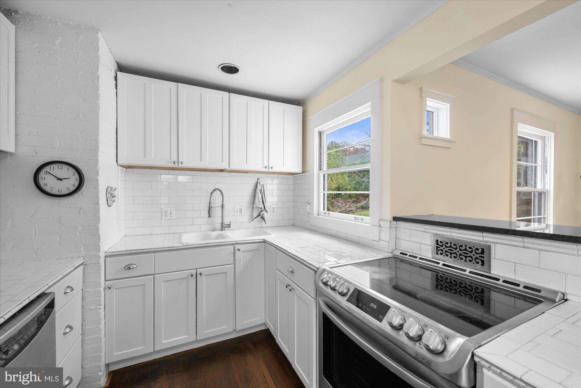 3010 Fayette Road Kensington, MD 20895 - Photo 9 of 54 a kitchen with a sink stove and cabinets