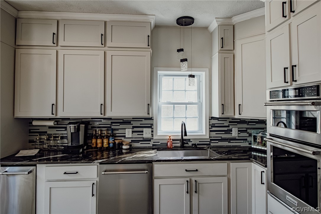 3105 Blue Bell Farms Road Powhatan, VA 23139 - Photo 11 of 50 a kitchen with stainless steel appliances granite countertop a sink and cabinets