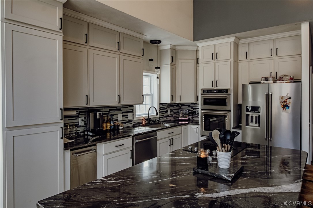 3105 Blue Bell Farms Road Powhatan, VA 23139 - Photo 12 of 50 a kitchen with a refrigerator and a stove top oven