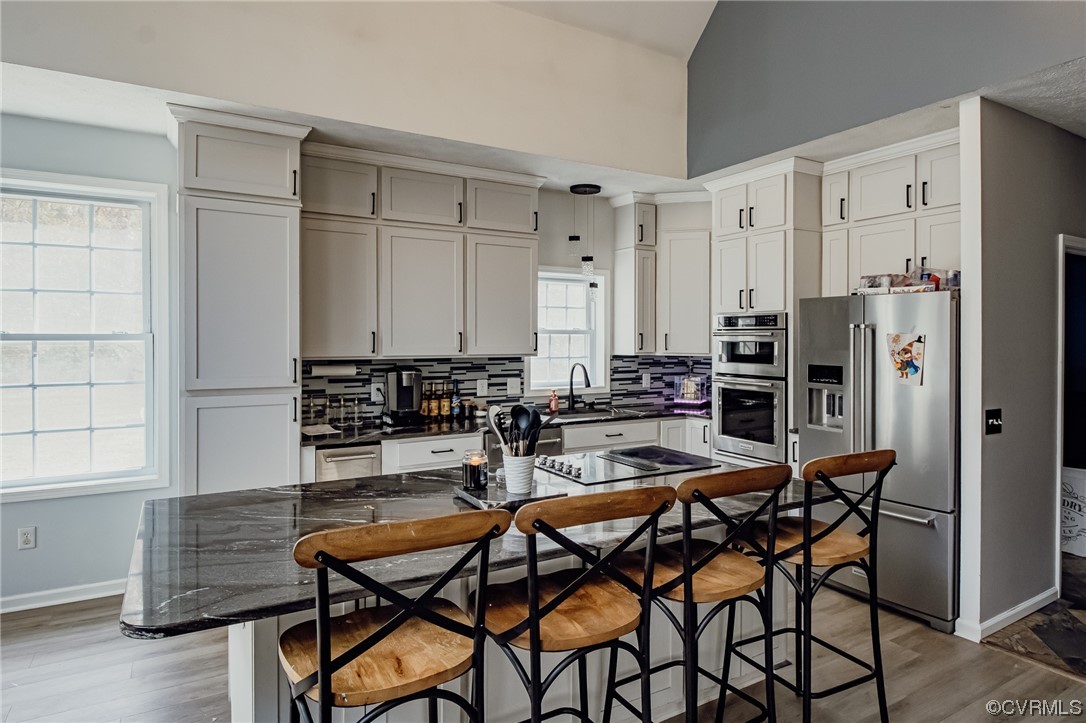 3105 Blue Bell Farms Road Powhatan, VA 23139 - Photo 14 of 50 a dining room with furniture and wooden floor