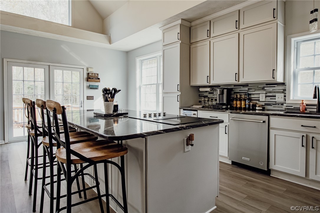 3105 Blue Bell Farms Road Powhatan, VA 23139 - Photo 15 of 50 a kitchen with a table chairs sink and cabinets
