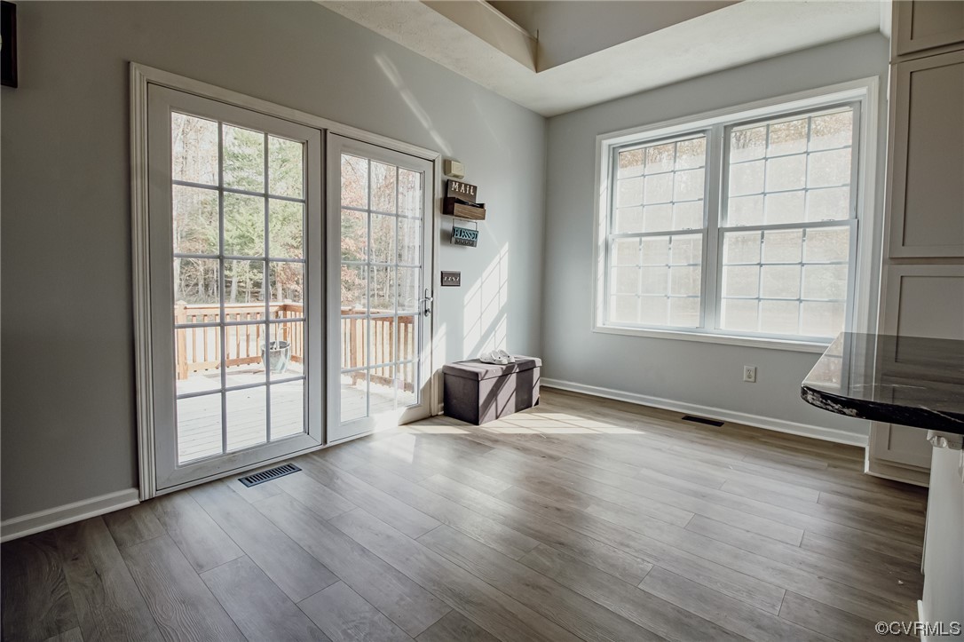 3105 Blue Bell Farms Road Powhatan, VA 23139 - Photo 16 of 50 an empty room with wooden floor and windows