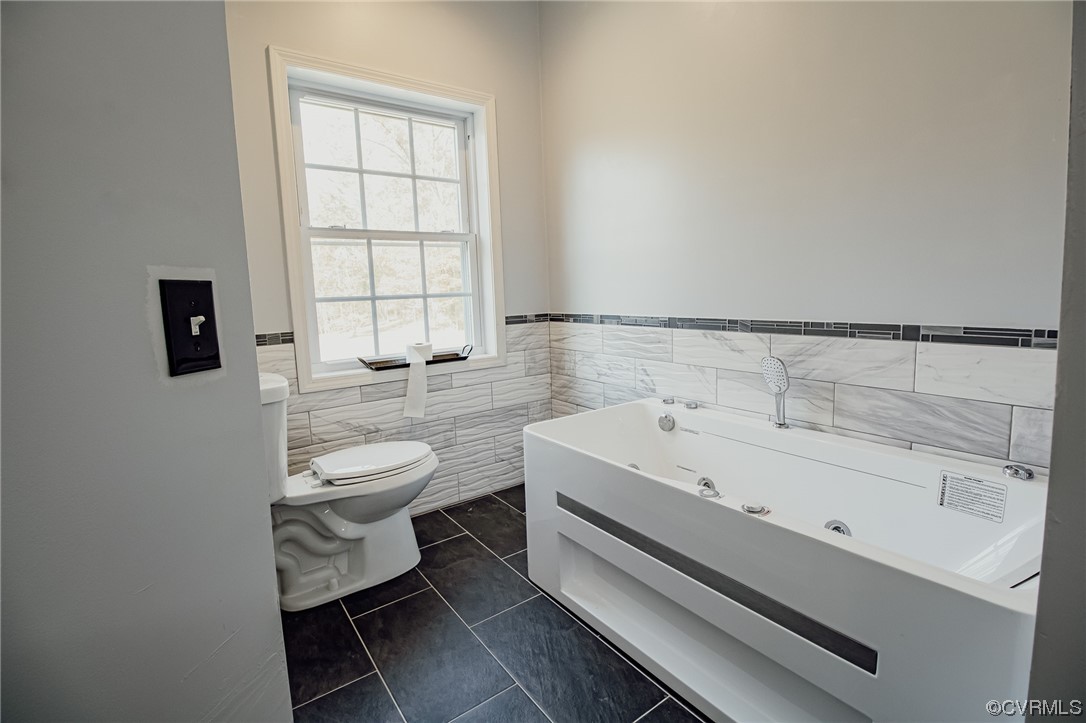 3105 Blue Bell Farms Road Powhatan, VA 23139 - Photo 25 of 50 a bathroom with a sink toilet and window