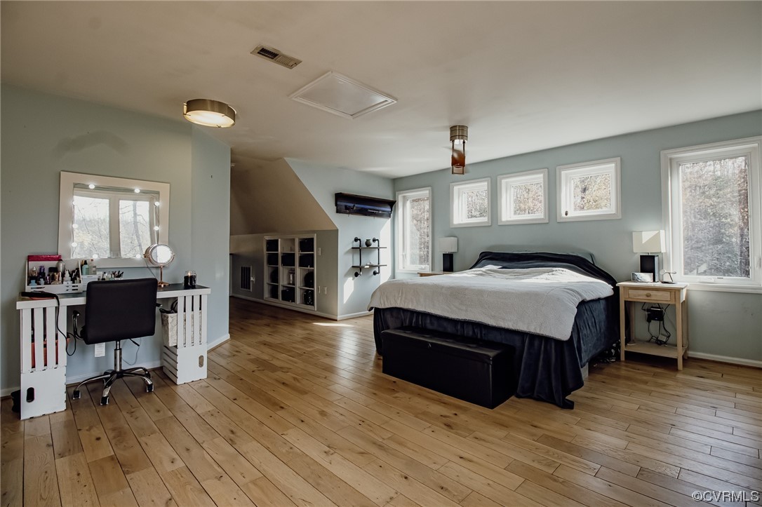 3105 Blue Bell Farms Road Powhatan, VA 23139 - Photo 36 of 50 a spacious bedroom with a bed and a table chair