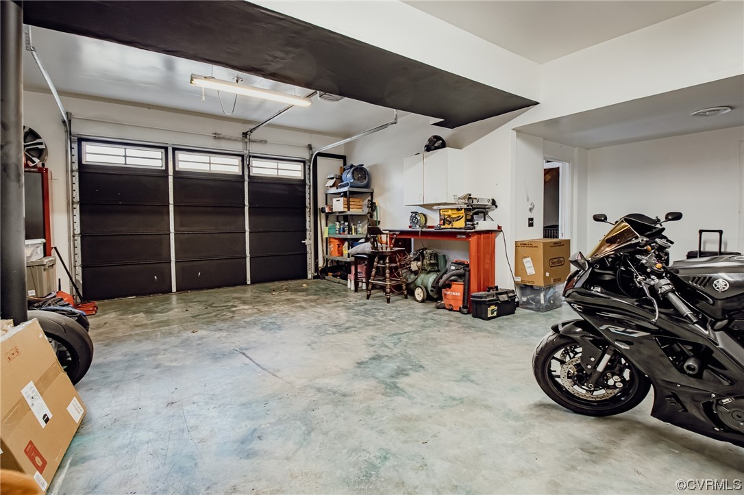 3105 Blue Bell Farms Road Powhatan, VA 23139 - Photo 42 of 50 a view of a garage with a bike and car