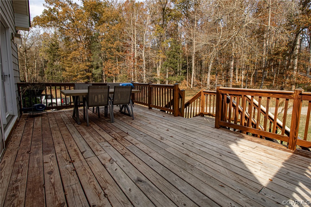3105 Blue Bell Farms Road Powhatan, VA 23139 - Photo 43 of 50 a view of a balcony with wooden floor and outdoor seating
