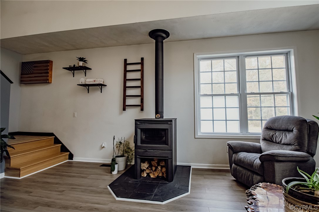 3105 Blue Bell Farms Road Powhatan, VA 23139 - Photo 9 of 50 a living room with furniture and a fireplace