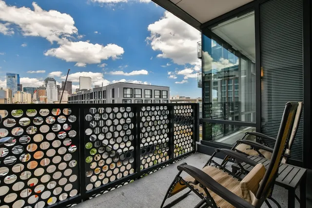 a view of a balcony with chairs