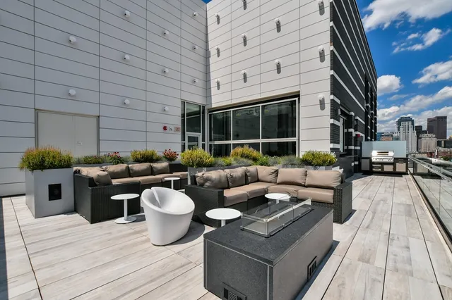 a view of a patio with couches and potted plants