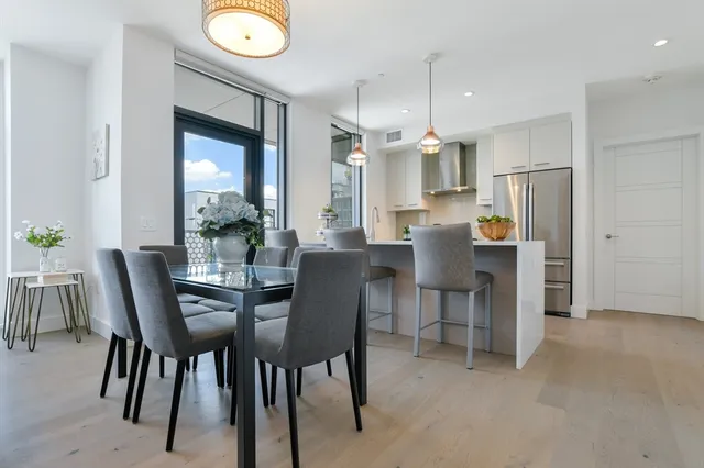 a view of a dining room with furniture and window