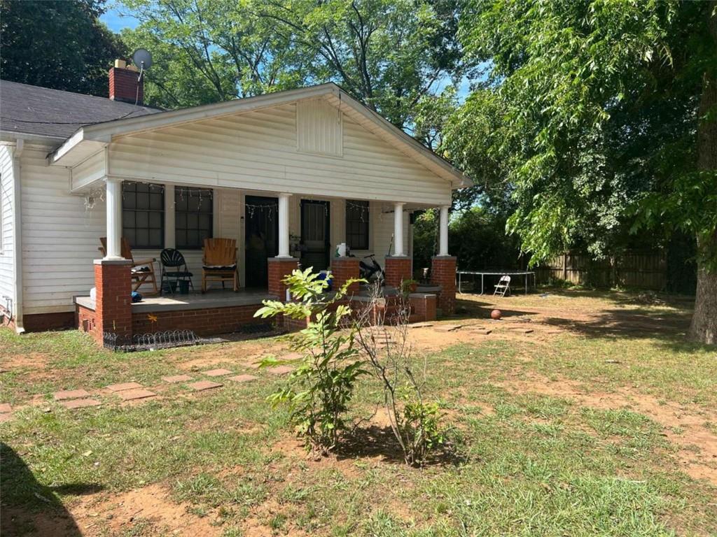 6 East 19th Street Rome, GA 30161 - Photo 1 of 1 a view of a house with swimming pool and sitting area