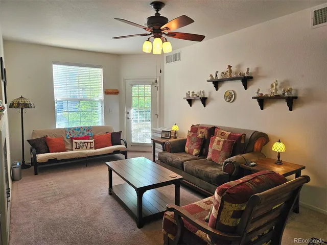 a living room with furniture and a window