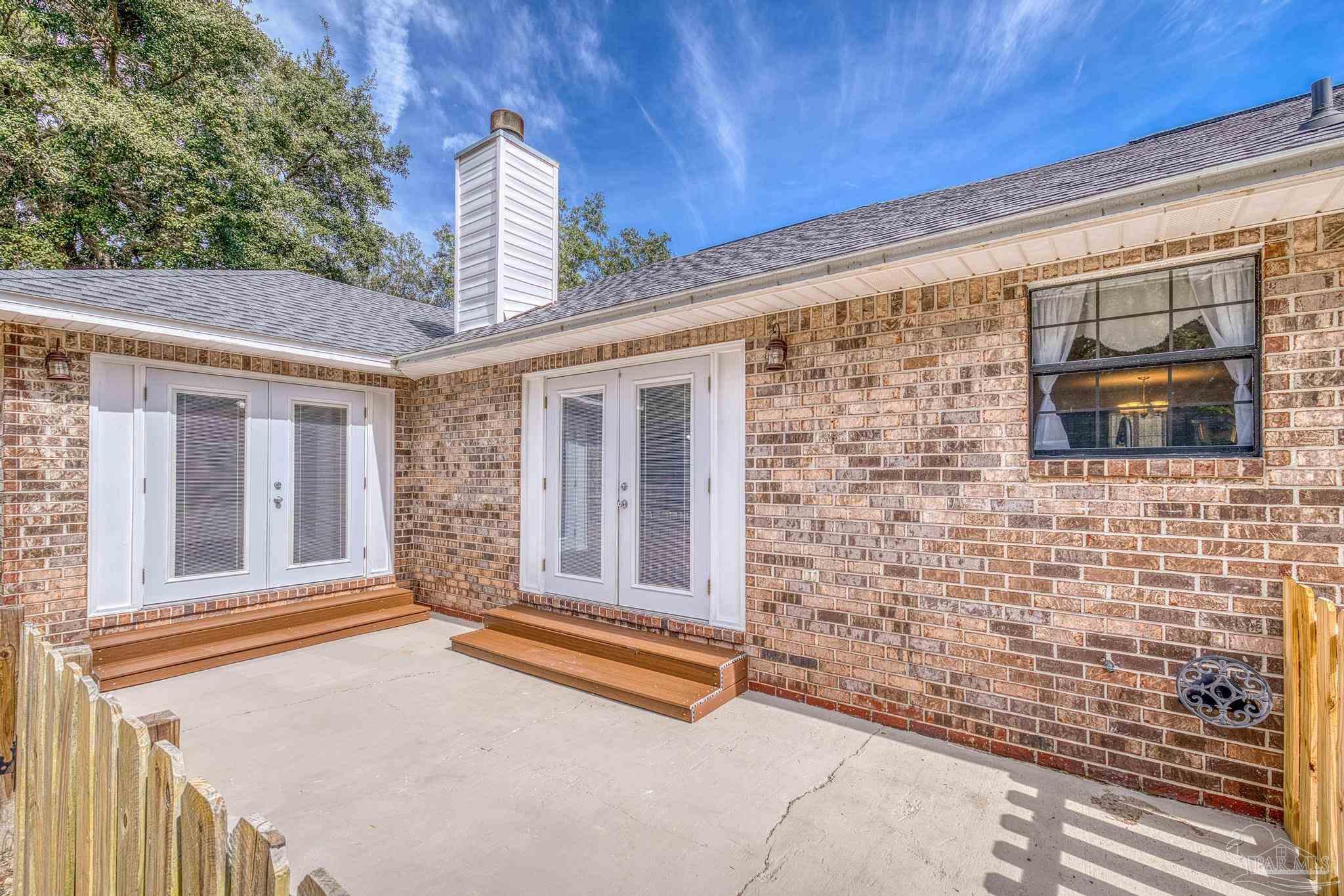 1747 New Hope Road Gulf Breeze, FL 32563 - Photo 30 of 52 doors off family room and primary suite