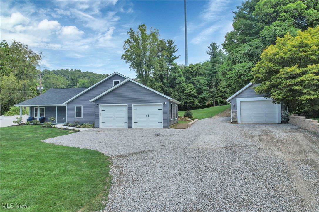 1890 Baltimore Road Northwest Lancaster, OH 43130 - Photo 4 of 50 Garage featuring a lawn
