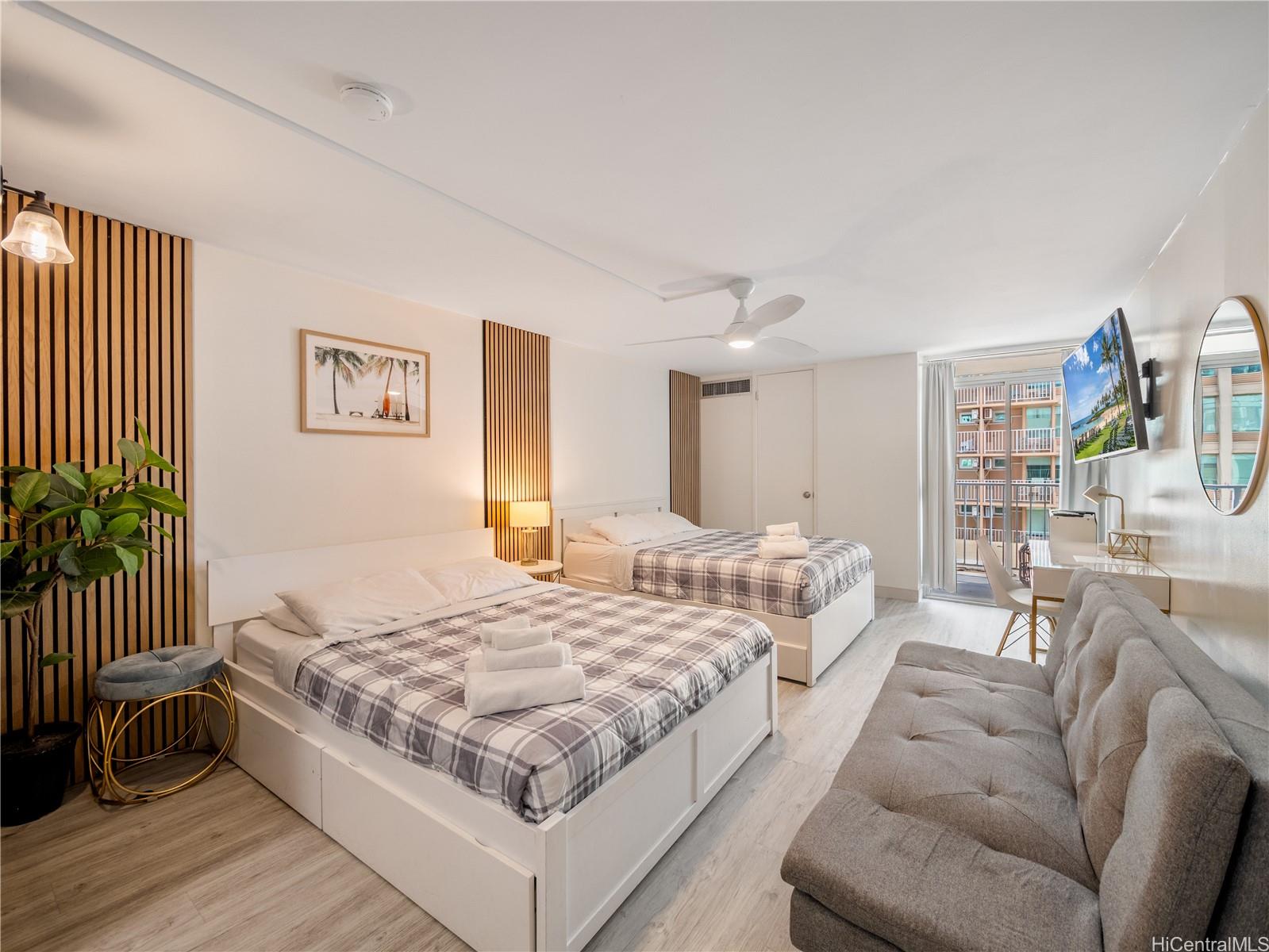 2572 Lemon Road, Unit 610 Honolulu, HI 96815 - Photo 12 of 24 a spacious bedroom with a bed and a couch