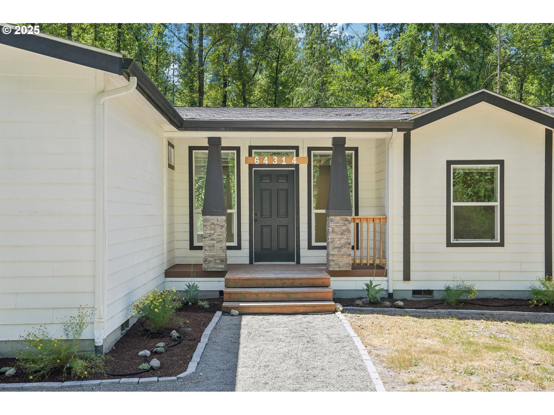 64314 East Barlow Trail Road Rhododendron, OR 97049 - Photo 3 of 30 a view of a house with a small yard