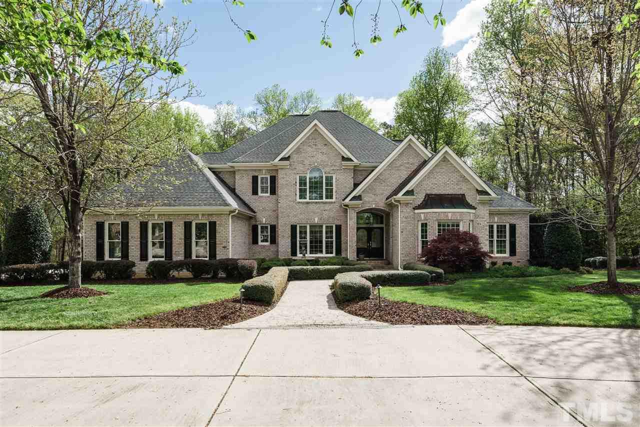 12432 Bayleaf Church Road Raleigh, NC 27614 - Photo 1 of 25 a front view of a house with a yard
