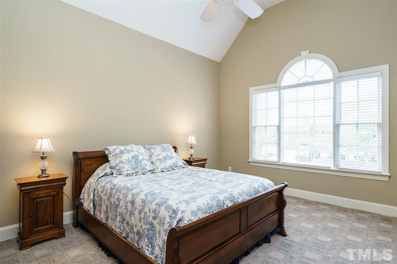 12432 Bayleaf Church Road Raleigh, NC 27614 - Photo 16 of 25 a bedroom with a bed and a window