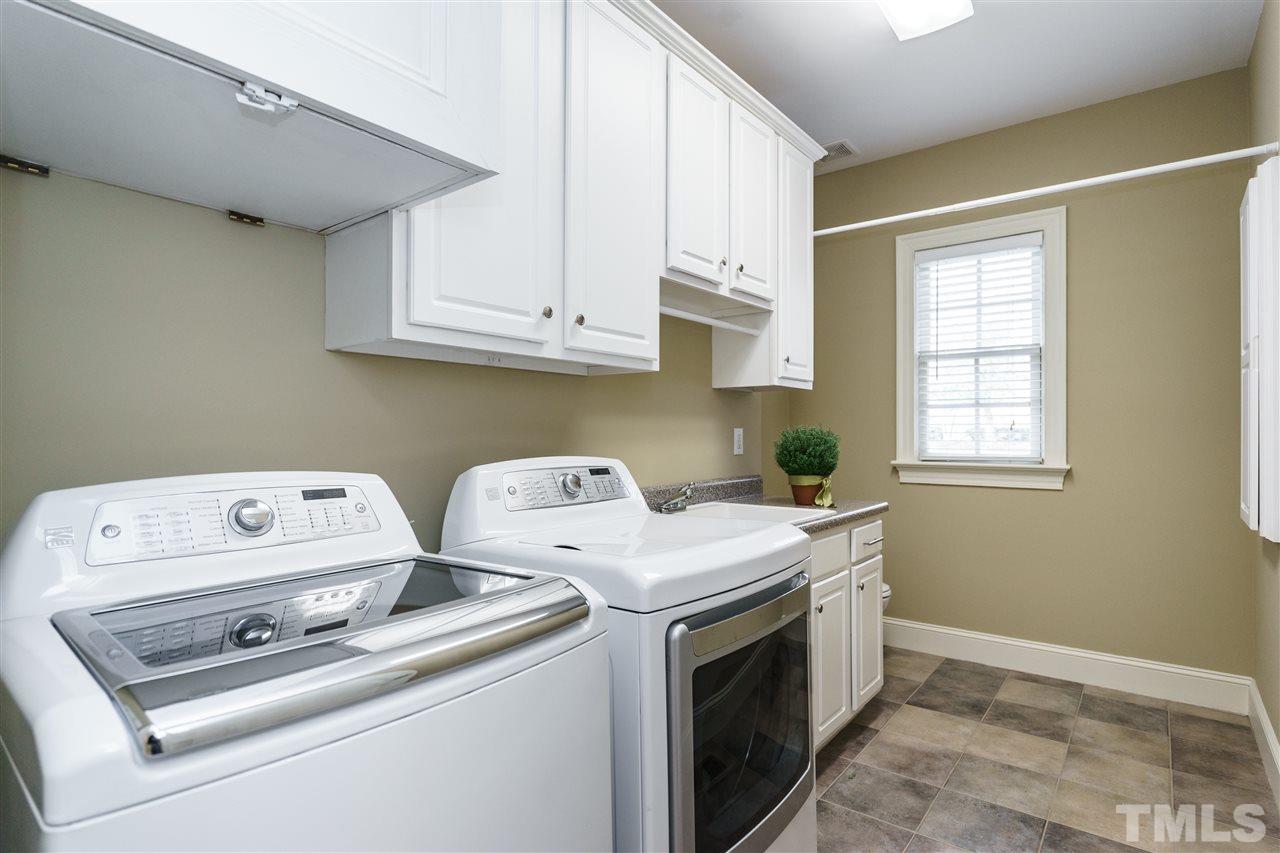 12432 Bayleaf Church Road Raleigh, NC 27614 - Photo 19 of 25 a utility room with dryer and washer