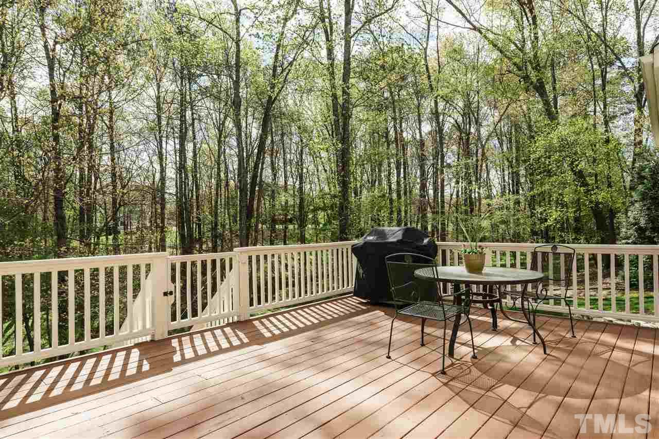 12432 Bayleaf Church Road Raleigh, NC 27614 - Photo 21 of 25 a view of a wooden chairs and bench on the deck