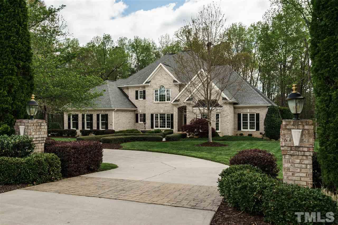12432 Bayleaf Church Road Raleigh, NC 27614 - Photo 25 of 25 a front view of a house with a garden and trees
