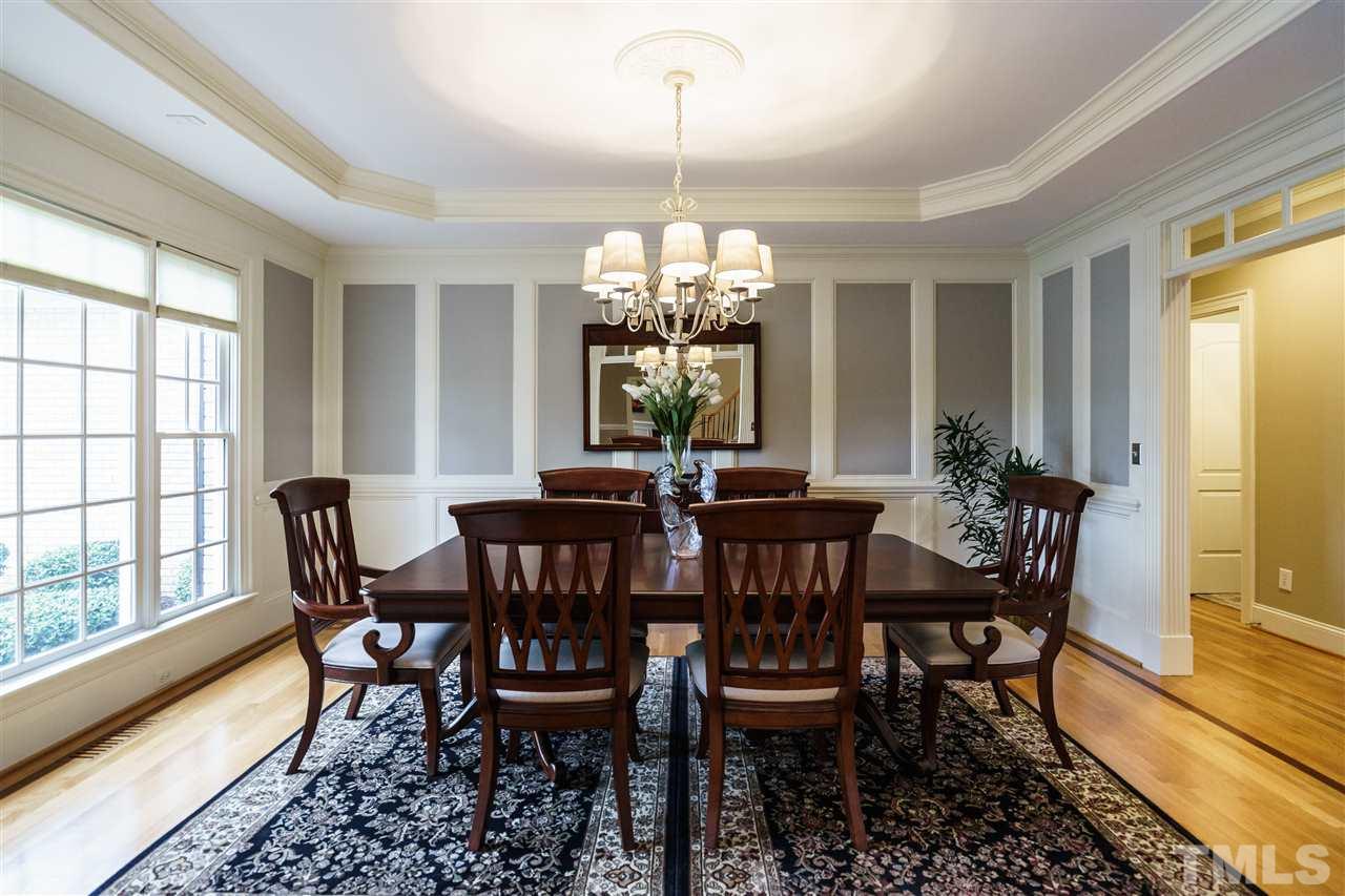 12432 Bayleaf Church Road Raleigh, NC 27614 - Photo 5 of 25 a dining room with furniture a chandelier and wooden floor