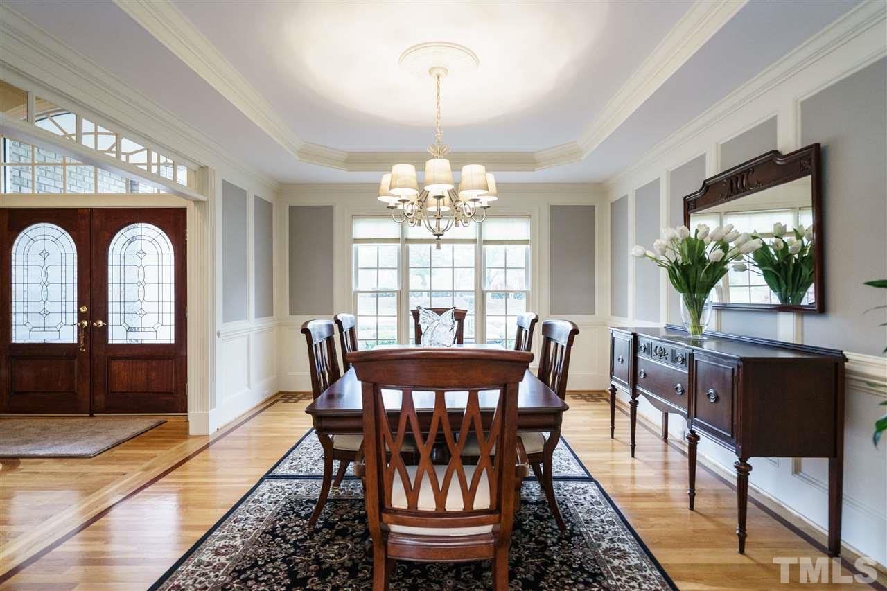 12432 Bayleaf Church Road Raleigh, NC 27614 - Photo 6 of 25 a view of a dining room with furniture window and wooden floor