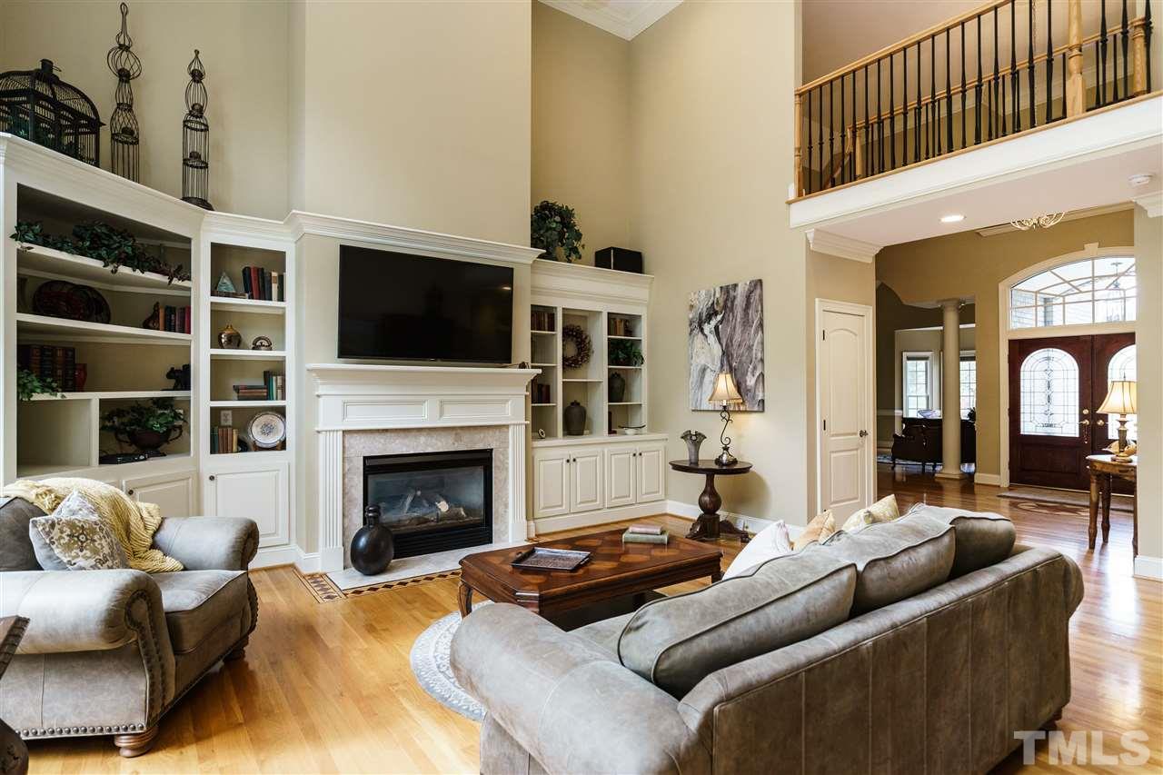 12432 Bayleaf Church Road Raleigh, NC 27614 - Photo 9 of 25 a living room with furniture fireplace and flat screen tv