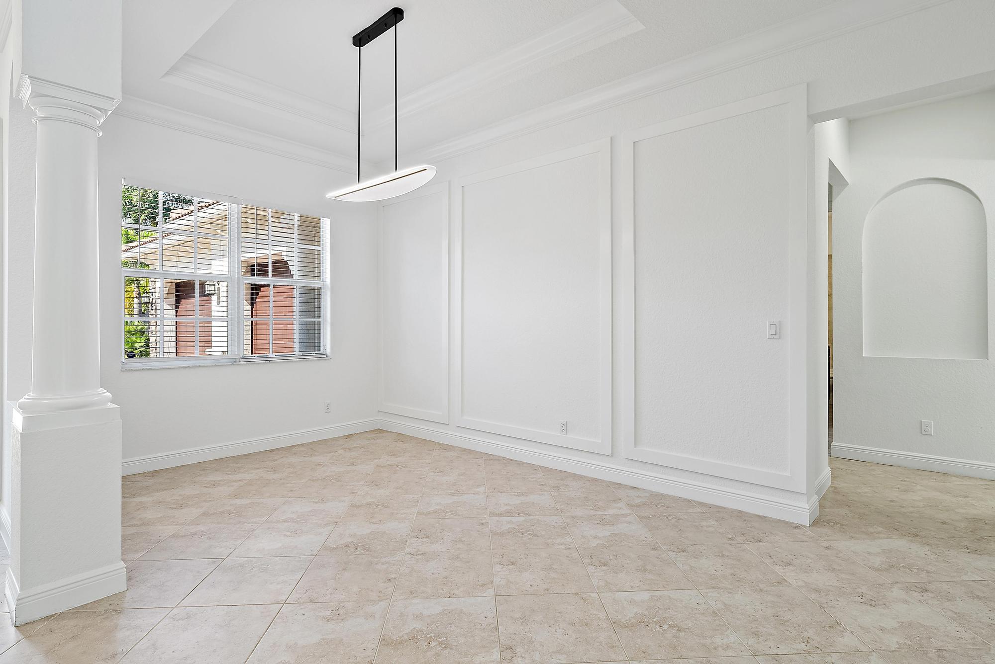 301 Rudder Cay Way Jupiter, FL 33458 - Photo 11 of 59 a view of an empty room with a window