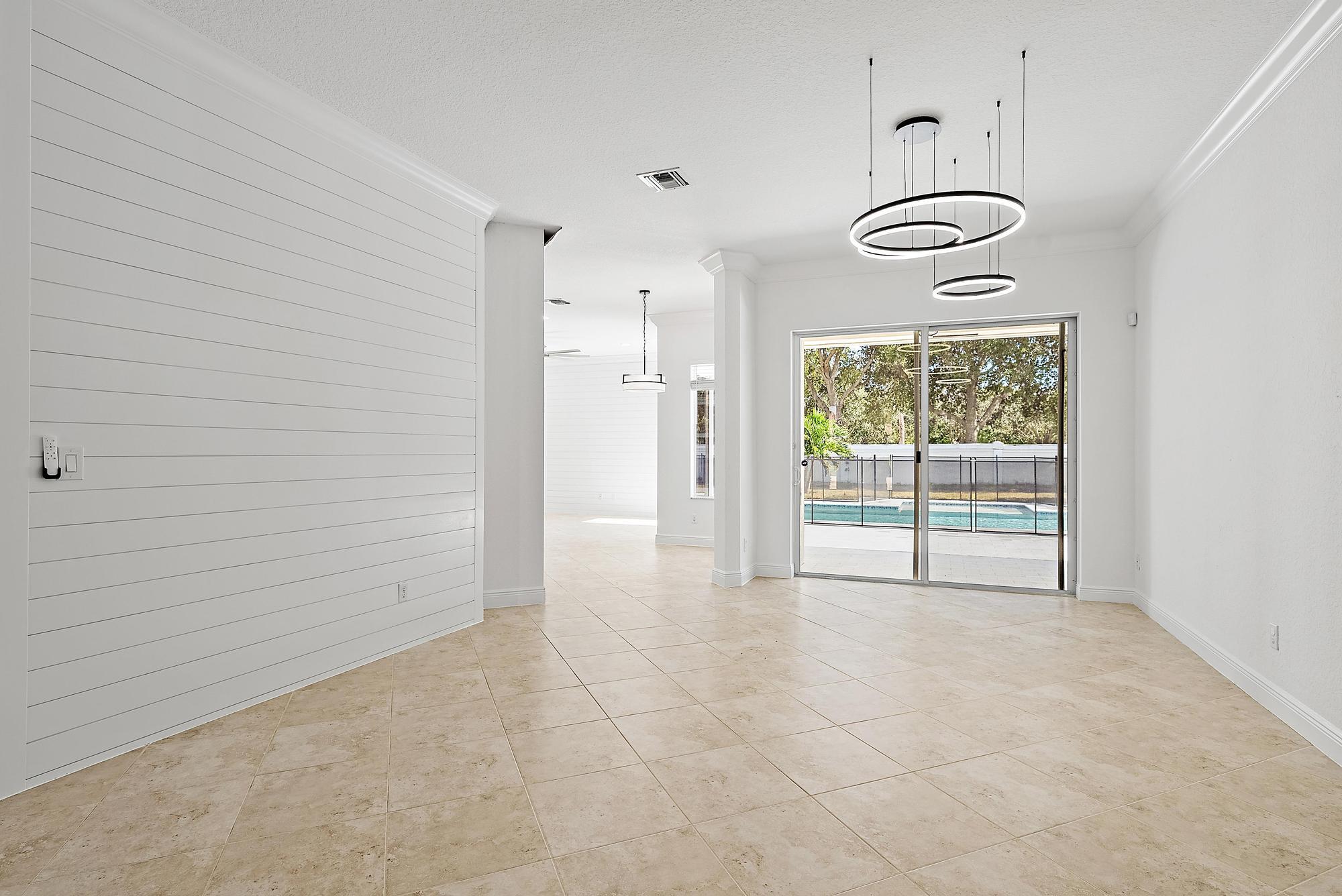 301 Rudder Cay Way Jupiter, FL 33458 - Photo 12 of 59 a view of empty room with windows