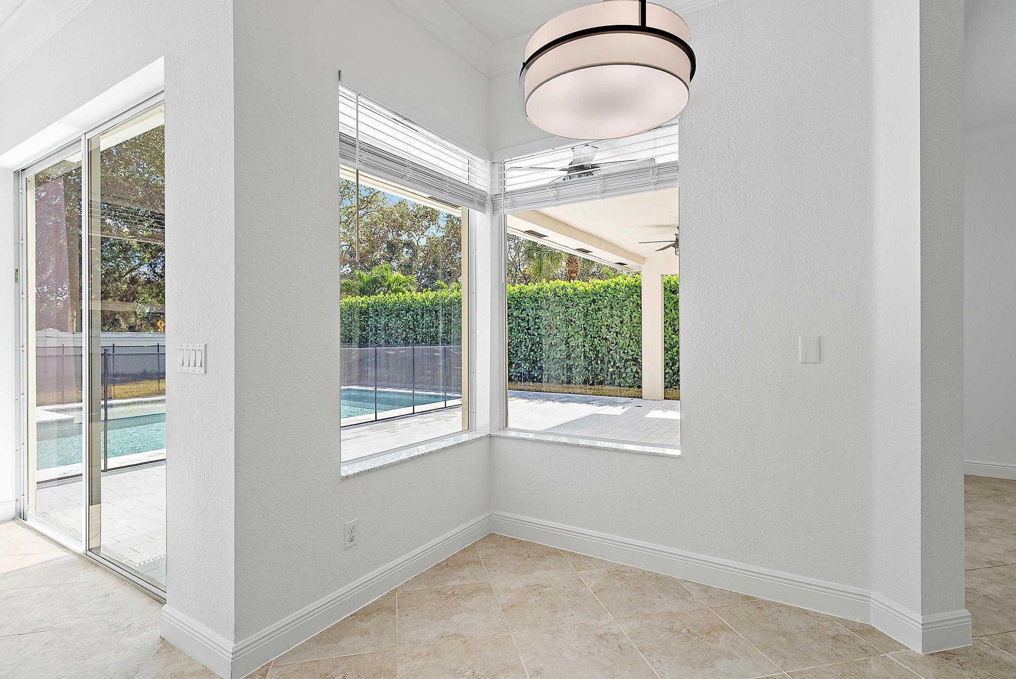 301 Rudder Cay Way Jupiter, FL 33458 - Photo 43 of 59 a very nice looking room with a large window and wooden floor