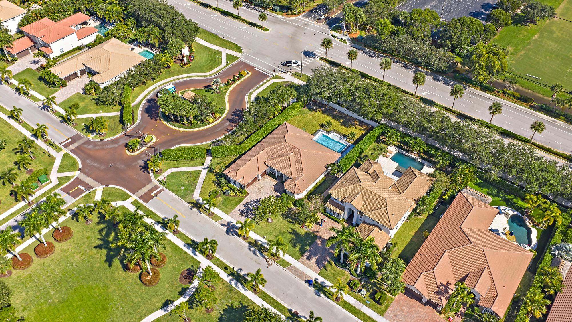 301 Rudder Cay Way Jupiter, FL 33458 - Photo 57 of 59 an aerial view of a house with a yard and outdoor seating