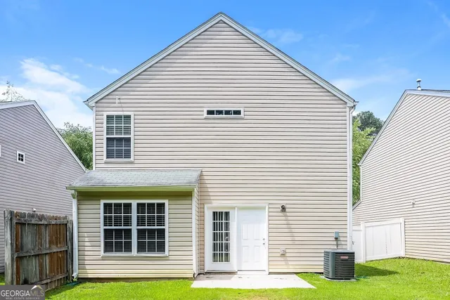 a view of a house and a yard