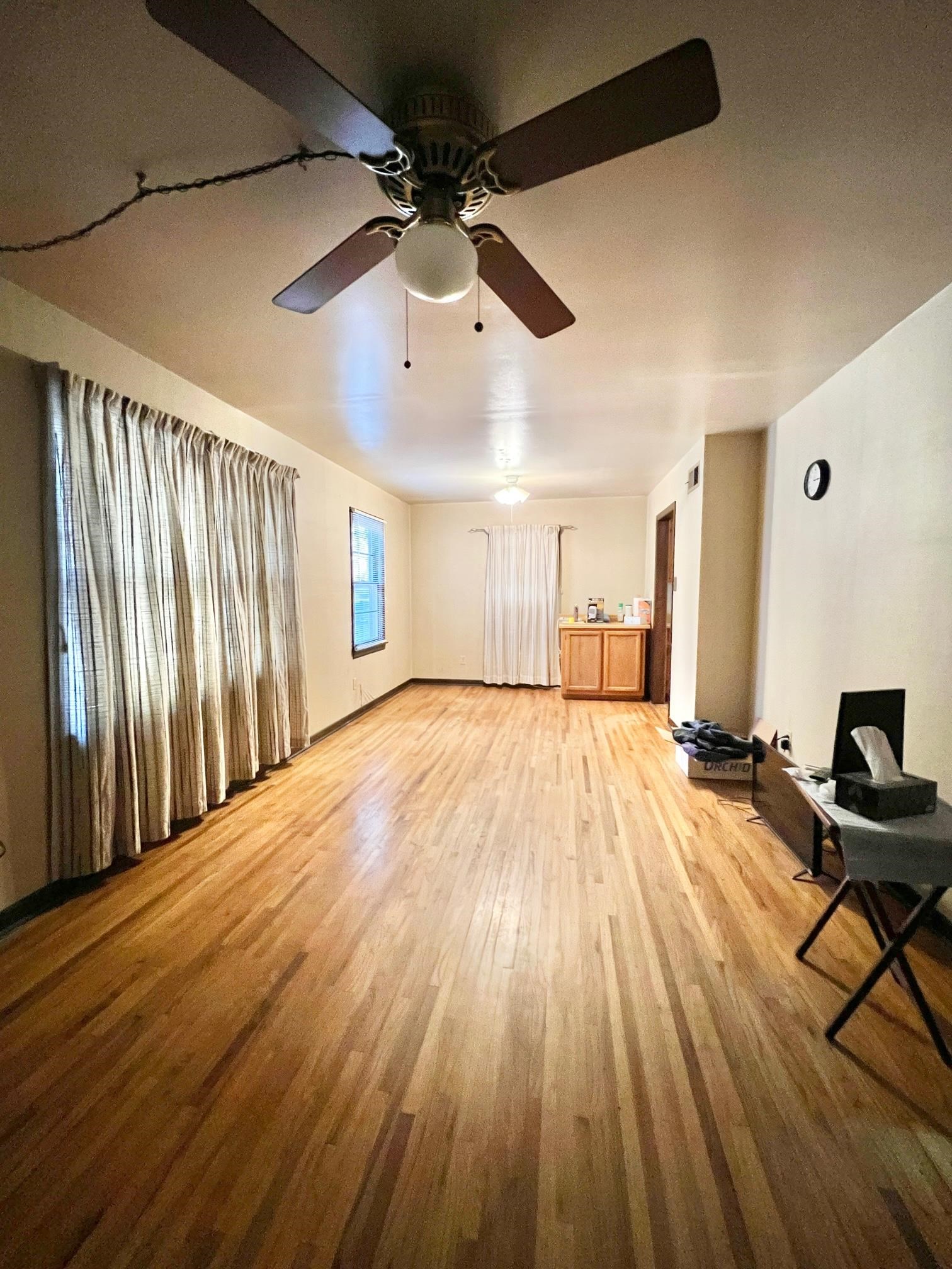 1411 Whitten Road Memphis, TN 38134 - Photo 3 of 9 a view of a room with wooden floor