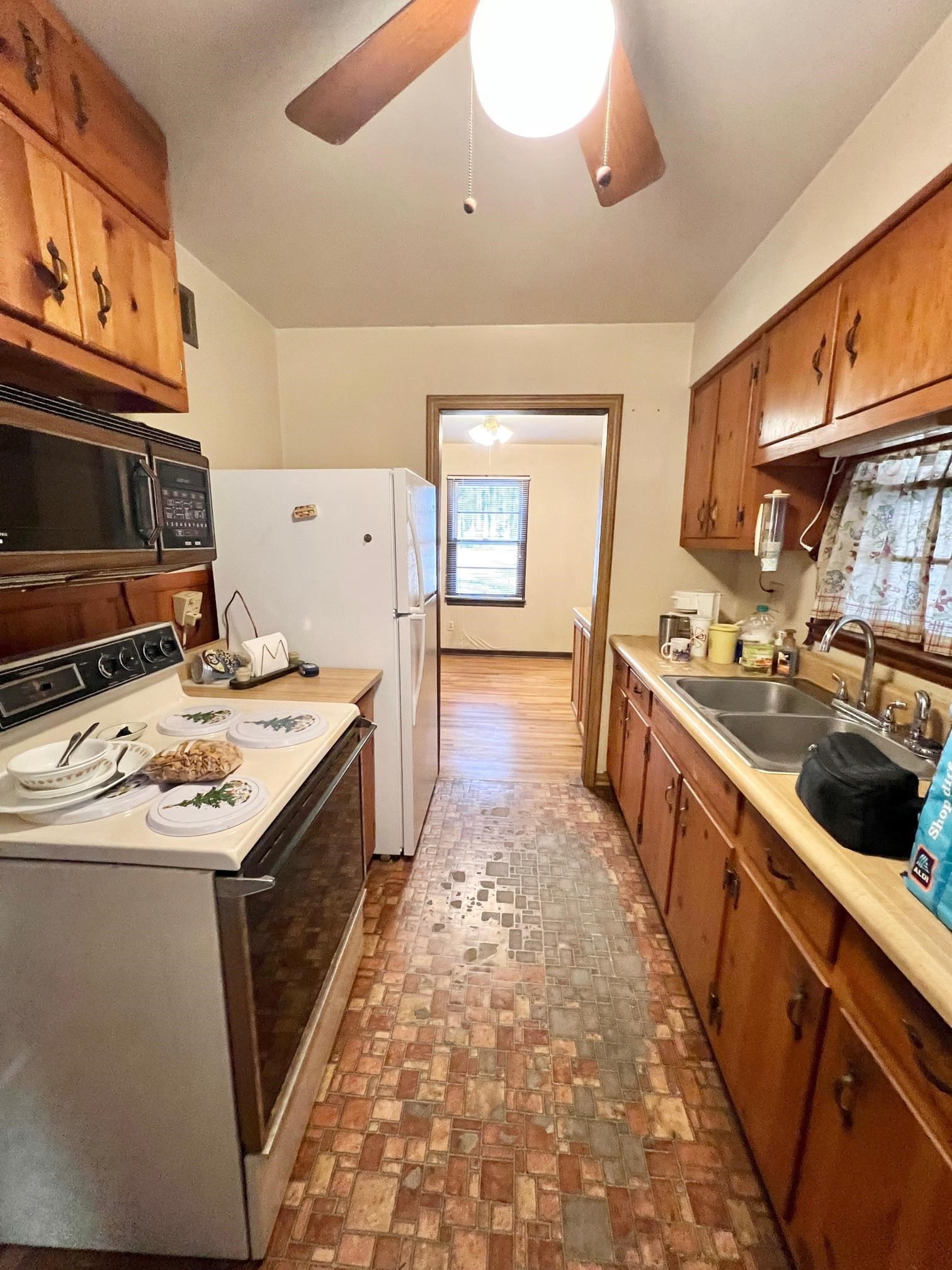 1411 Whitten Road Memphis, TN 38134 - Photo 4 of 9 a kitchen with a stove and a sink