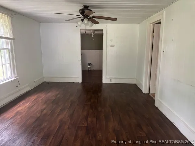 a backyard of a house with shaded area