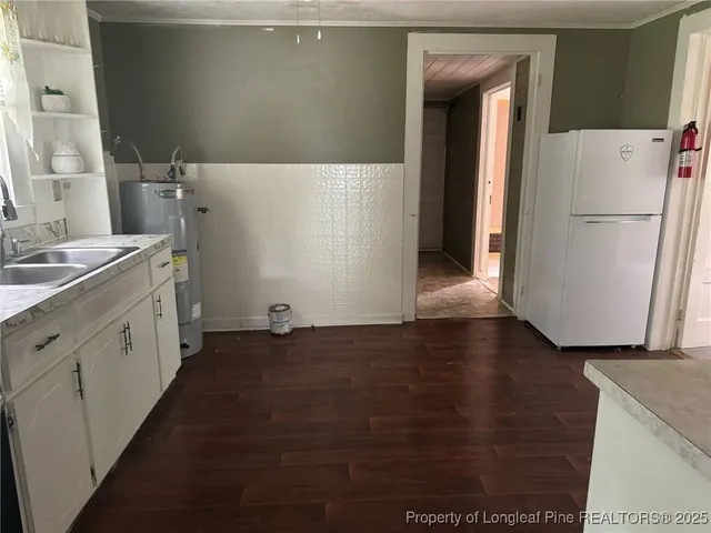 a view of a kitchen with wooden floor