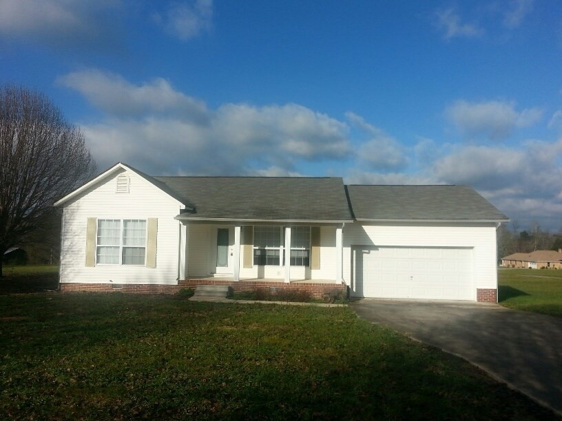 1068 Keith Valley Road Southeast Cleveland, TN 37323 - Photo 1 of 1 a front view of a house with a garden and yard