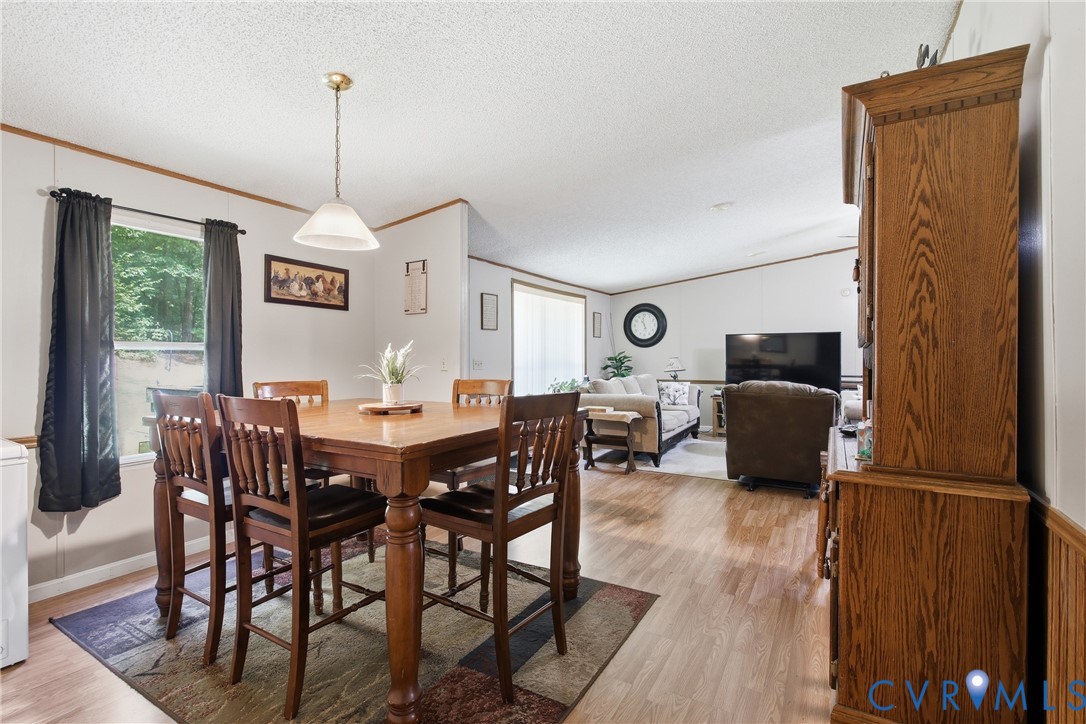 14720 Spring Creek Road Dinwiddie, VA 23841 - Photo 14 of 32 Wood-finish flooring throughout, a dining area wit