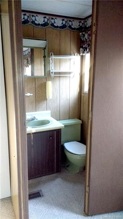 165 Brown Neal Road, Unit 17 York, SC 29745 - Photo 4 of 9 a bathroom with a granite countertop sink toilet and shower