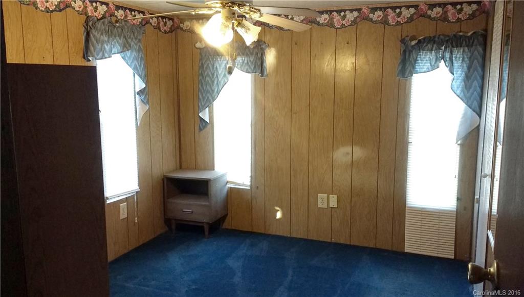 165 Brown Neal Road, Unit 17 York, SC 29745 - Photo 5 of 9 a view of an empty room with wooden floor and a window