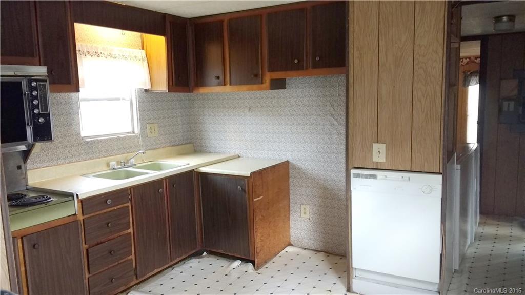165 Brown Neal Road, Unit 17 York, SC 29745 - Photo 8 of 9 a kitchen with stainless steel appliances granite countertop a refrigerator and a sink