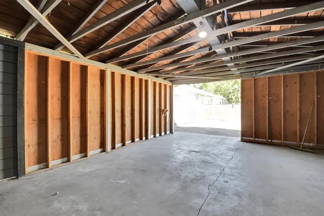 a view of an empty room with a staircase