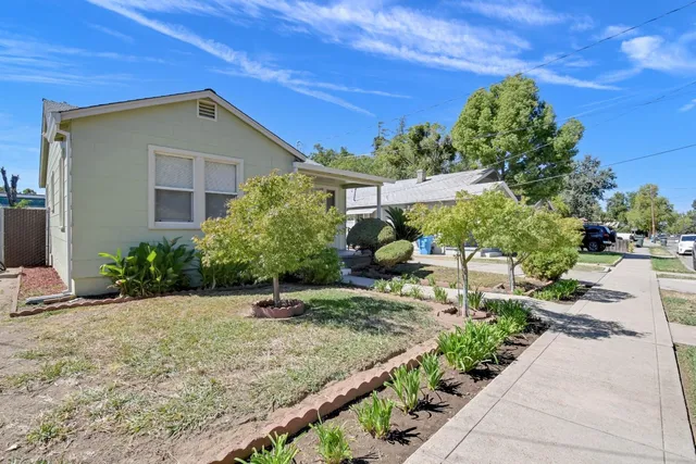 a front view of a house with garden