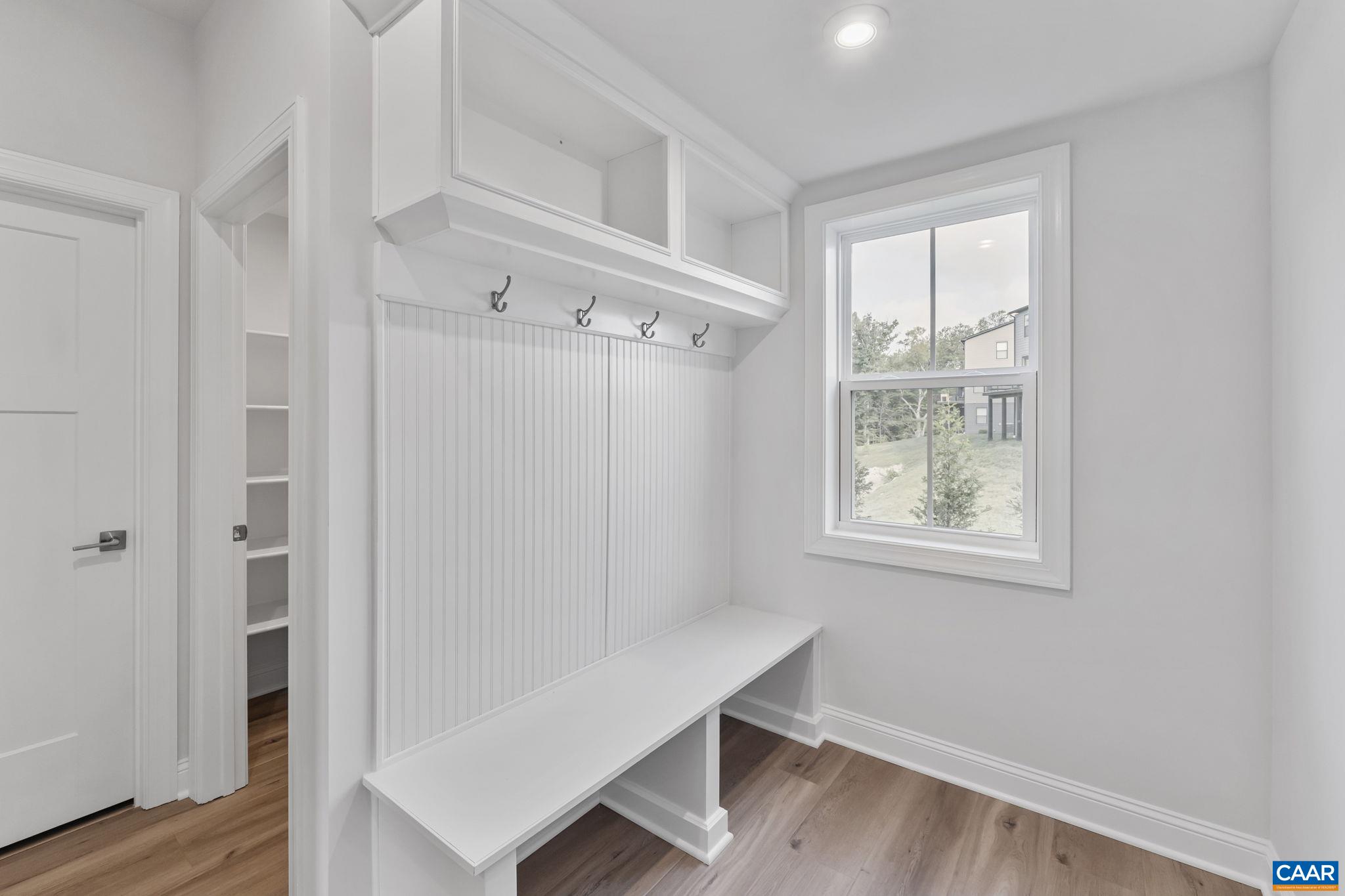 1805 Fowler Street Charlottesville, VA 22901 - Photo 25 of 60 a view of an empty room with wooden floor and a window