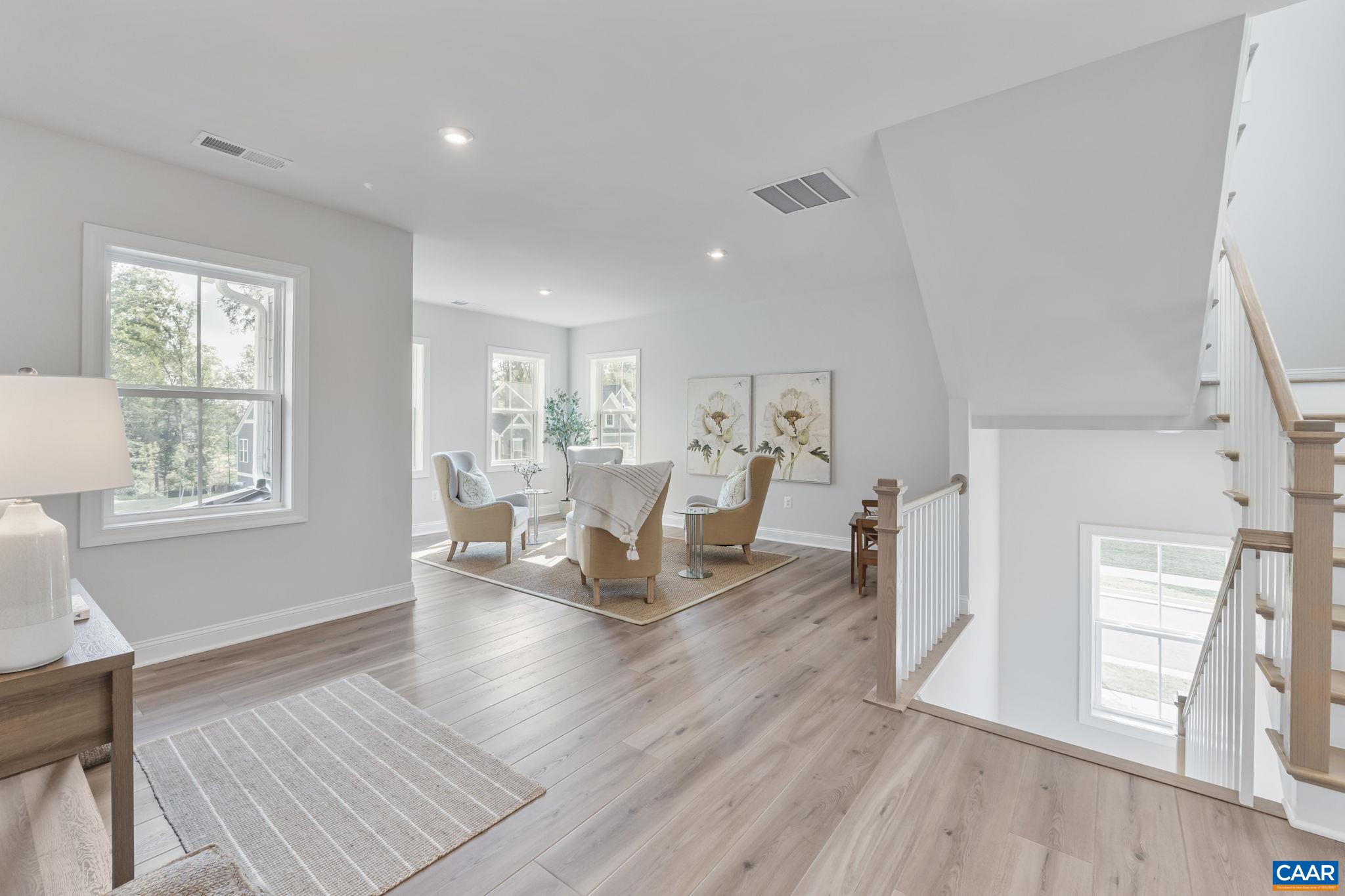 1805 Fowler Street Charlottesville, VA 22901 - Photo 28 of 60 a living room with furniture and a wooden floor