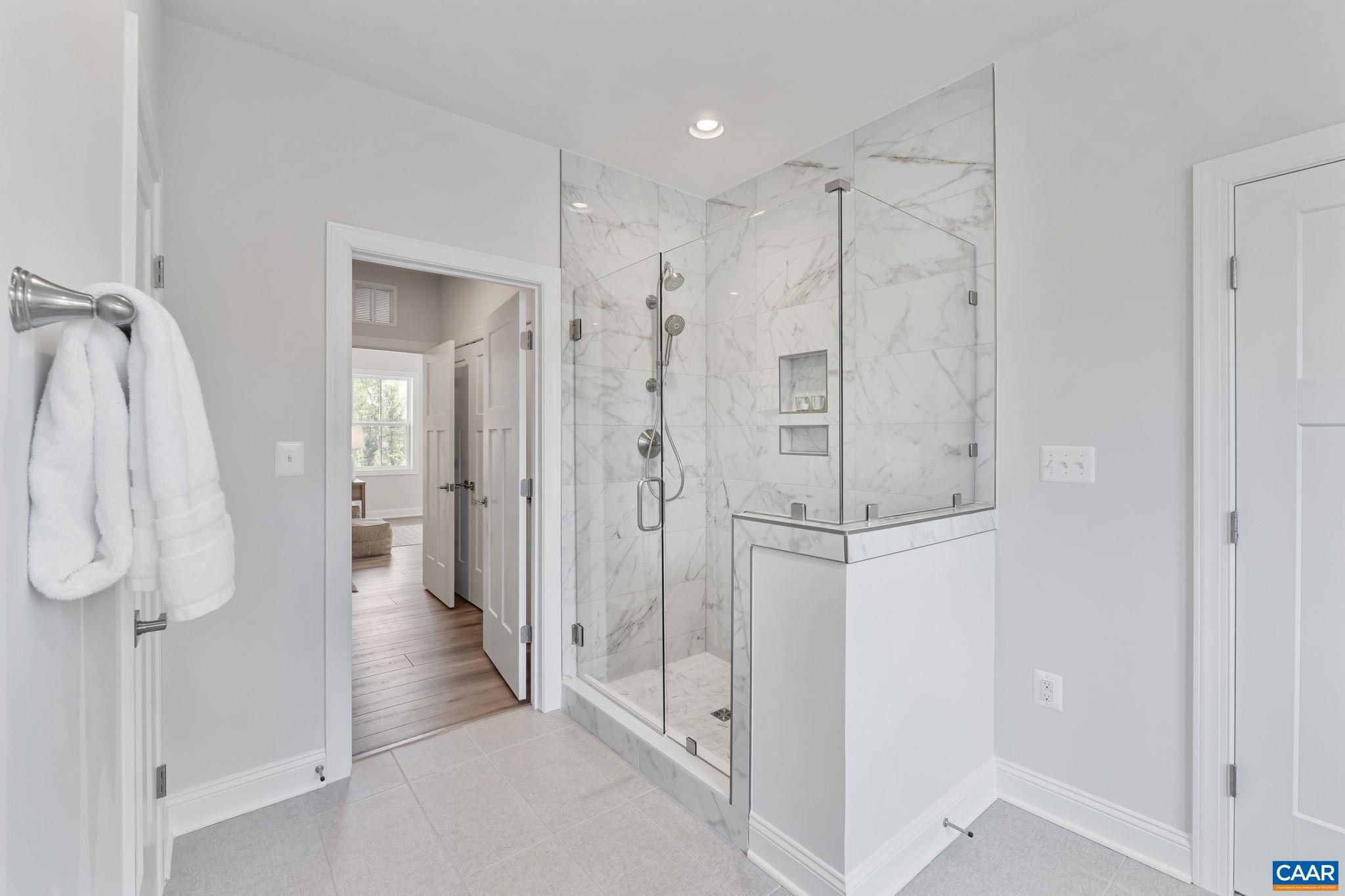 1805 Fowler Street Charlottesville, VA 22901 - Photo 36 of 60 a bathroom with a shower and a glass door