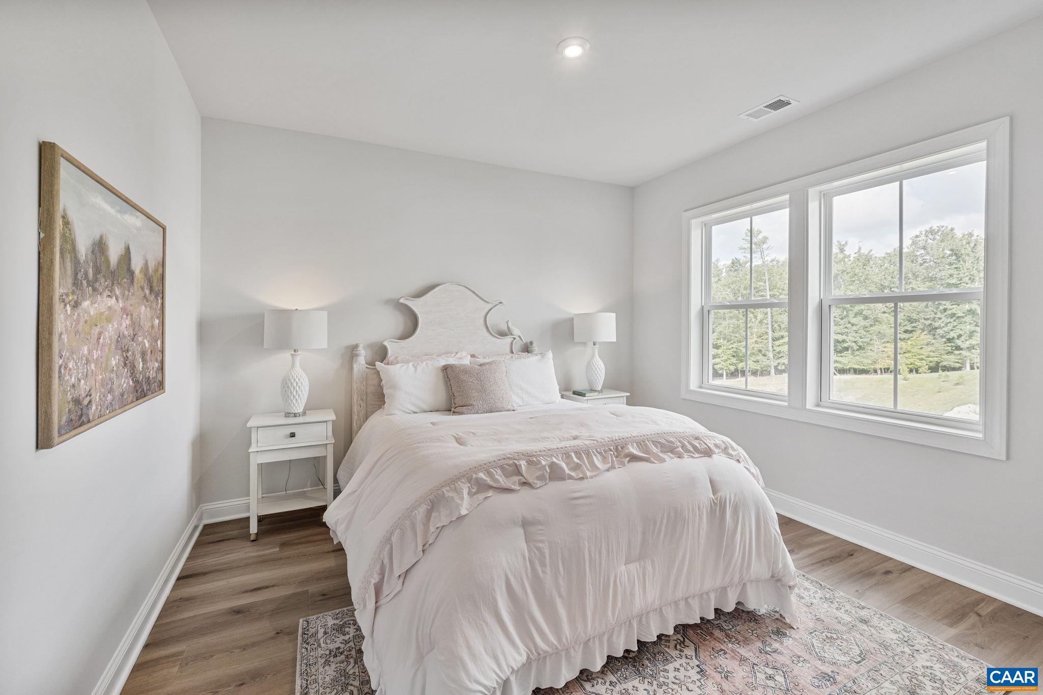 1805 Fowler Street Charlottesville, VA 22901 - Photo 42 of 60 a large bed sitting in a bedroom next to a window